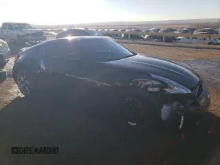 2014 Nissan 370Z Nismo z VIN JN1AZ4EHXEM632166, wystawiony jako Copart lot #88311915 z przebiegiem 18 414 mil mil oraz Szkoda całkowita • Salvage title. Historia ofert i sprzedaży dostępna na DreamBid. Obrazek 4.