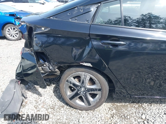 2021 Toyota Prius L Eco with VIN JTDKAMFU8M3136565, listed as a IAAI auction lot 42161896 with 39,634 mi miles and . Bid and sale history available at DreamBid. Image 6.