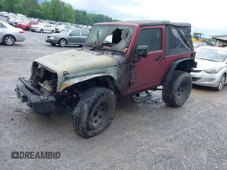 2012 Jeep Wrangler Sport with VIN 1C4AJWAG9CL203018, listed as a IAAI auction lot 42377899 with Not provided miles and . Bid and sale history available at DreamBid. Image 2.