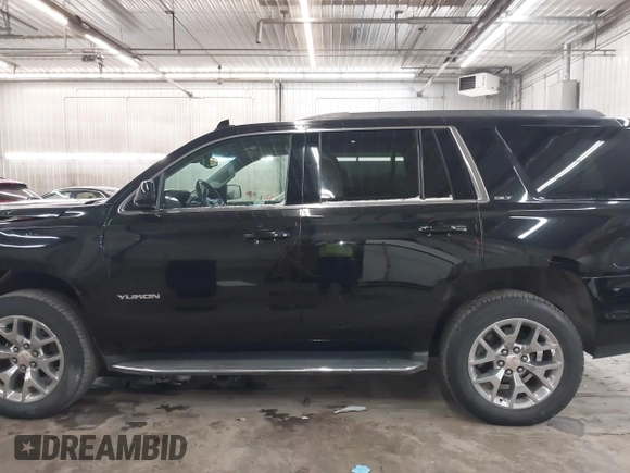2016 GMC Yukon SLT with VIN 1GKS2BKC9GR176948, listed as a IAAI auction lot 41361221 with 125,178 mi miles. Bid and sale history available at carsss.com. Image 15.