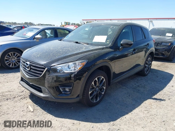 2016 Mazda CX-5 Grand Touring with VIN JM3KE4DY9G0893174, listed as a IAAI auction lot 41887814 with 79,811 mi miles. Bid and sale history available at carsss.com. Image 16.