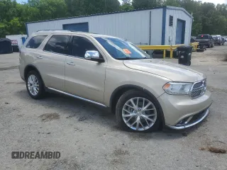 2015 Dodge Durango Citadel with VIN 1C4SDHET0FC873740, listed as a Copart auction lot 56067255 with 131,362 mi miles and Salvage title. Bid and sale history available at DreamBid. Image 4.