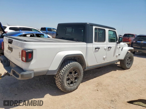 2023 Jeep Gladiator Sport S with VIN 1C6HJTAG4PL564716, listed as a Copart auction lot 57489125 with 20,971 mi miles and Salvage title. Bid and sale history available at DreamBid. Image 3.