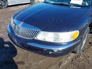 1999 Lincoln Continental with VIN 1LNHM97V8XY700644, listed as a IAAI auction lot 41641082 with 142,527 mi miles. Bid and sale history available at carsss.com. Image 6.