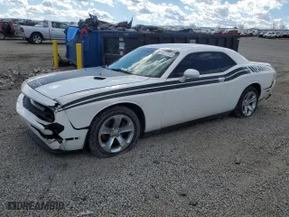 2012 Dodge Challenger SXT Plus with VIN 2C3CDYAG7CH128168, listed as a Copart auction lot 47273945 with 196,025 mi miles and Salvage Title. Bid and sale history available at carsss.com. Image 1.