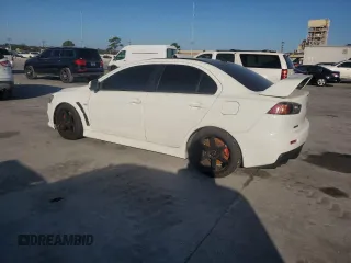 2014 Mitsubishi Lancer Evolution GSR z VIN JA32W8FV5EU023703, wystawiony jako Copart lot #72744504 z przebiegiem Nie podano mil oraz Szkody całkowita. Historia ofert i sprzedaży dostępna na DreamBid. Obrazek 2.