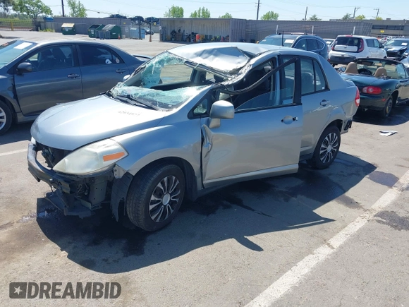2009 Nissan Versa 1.8 S with VIN 3N1BC11E09L449780, listed as a IAAI auction lot 42034977 with 180,680 mi miles. Bid and sale history available at carsss.com. Image 2.