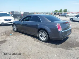 2014 Chrysler 300 with VIN 2C3CCAAG3EH237157, listed as a IAAI auction lot 41986053 with 61,372 mi miles and . Bid and sale history available at DreamBid. Image 3.