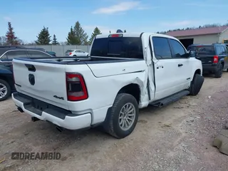 2023 Ram 1500 Laramie with VIN 1C6SRFJT8PN520610, listed as a IAAI auction lot 41898526 with 23,605 mi miles and . Bid and sale history available at DreamBid. Image 4.