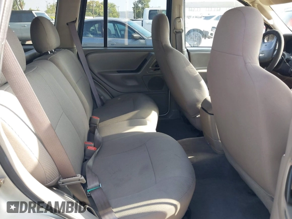 2004 Jeep Grand Cherokee Laredo with VIN 1J4GX48N24C334983, listed as a IAAI auction lot 42522088 with 169,793 mi miles and . Bid and sale history available at DreamBid. Image 8.