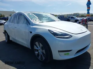 2023 Tesla Model Y Long Range with VIN 7SAYGDEE2PF632121, listed as a IAAI auction lot 41798780 with 53,773 mi miles. Bid and sale history available at carsss.com. Image 1.