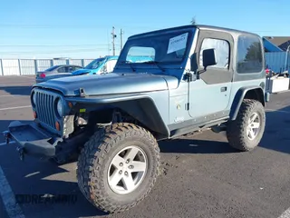 1998 Jeep Wrangler Sport with VIN 1J4FY19S4WP716469, listed as a IAAI auction lot 41506513 with 142,289 mi miles. Bid and sale history available at carsss.com. Image 2.