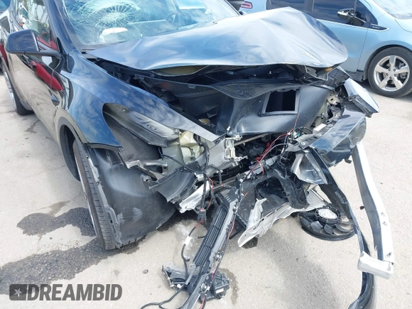 2023 Tesla Model Y Long Range z VIN 7SAYGDEE2PF863200, wystawiony jako IAAI lot #41805168 z przebiegiem 25 480 mil mil oraz . Historia ofert i sprzedaży dostępna na DreamBid. Obrazek 6.
