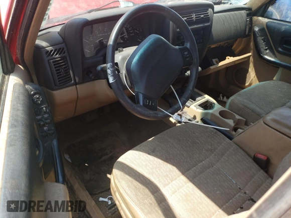 1999 Jeep Cherokee Sport z VIN 1J4FF68SXXL662401, wystawiony jako Copart lot #59698565 z przebiegiem Nie podano mil oraz Szkoda całkowita • Salvage title. Historia ofert i sprzedaży dostępna na DreamBid. Obrazek 8.