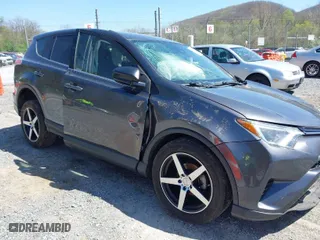 2018 Toyota RAV4 LE with VIN JTMBFREV0JJ722483, listed as a IAAI auction lot 41982973 with 83,012 mi miles. Bid and sale history available at carsss.com. Image 1.