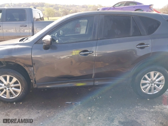 2016 Mazda CX-5 Touring with VIN JM3KE4CY3G0672977, listed as a IAAI auction lot 41889137 with 130,593 mi miles. Bid and sale history available at carsss.com. Image 15.