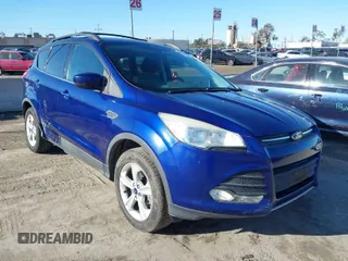 2014 Ford Escape SE with VIN 1FMCU0G99EUC76078, listed as a IAAI auction lot 41814295 with 114,876 mi miles. Bid and sale history available at carsss.com. Image 1.