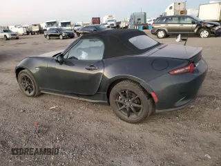 2021 Mazda MX-5 Miata Sport with VIN JM1NDAB79M0454876, listed as a Copart auction lot 82086434 with 74,035 mi miles and Salvage title. Bid and sale history available at DreamBid. Image 2.