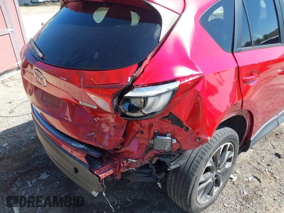 2016 Mazda CX-5 Grand Touring with VIN JM3KE2DY3G0686588, listed as a IAAI auction lot 41697312 with 65,090 mi miles. Bid and sale history available at carsss.com. Image 6.
