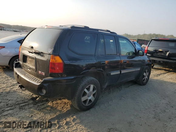 2004 GMC Envoy SLT with VIN 1GKDT13S942407244, listed as a Copart auction lot 70995064 with 162,676 mi miles and Salvage Title. Bid and sale history available at carsss.com. Image 3.