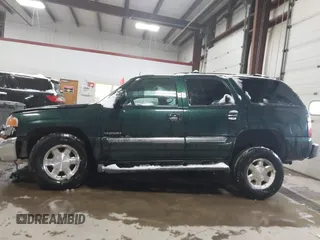 2004 GMC Yukon SLT with VIN 1GKEK13ZX4R198169, listed as a IAAI auction lot 41577015 with 169,562 mi miles. Bid and sale history available at carsss.com. Image 14.