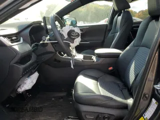 2023 Toyota RAV4 Hybrid XSE with VIN 4T3E6RFV1PU112579, listed as a Copart auction lot 74387924 with 103,340 mi miles and Salvage title. Bid and sale history available at DreamBid. Image 7.