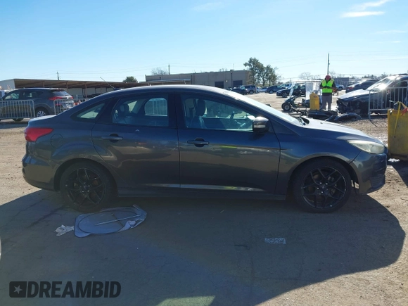 2016 Ford Focus SE z VIN 1FADP3F27GL321507, wystawiony jako IAAI lot #41278203 z przebiegiem 157 910 mil mil oraz . Historia ofert i sprzedaży dostępna na DreamBid. Obrazek 13.