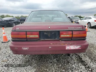 1991 Toyota Camry DLX z VIN 4T1SV21E0MU450578, wystawiony jako Copart lot #73990024 z przebiegiem 149 342 mil mil oraz Czysty tytuł • Clean title. Historia ofert i sprzedaży dostępna na DreamBid. Obrazek 6.