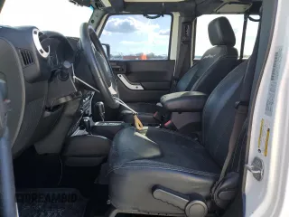 2015 Jeep Wrangler Unlimited Sahara with VIN 1C4BJWEG6FL614671, listed as a Copart auction lot 86052284 with 92,894 mi miles and Salvage title. Bid and sale history available at DreamBid. Image 7.