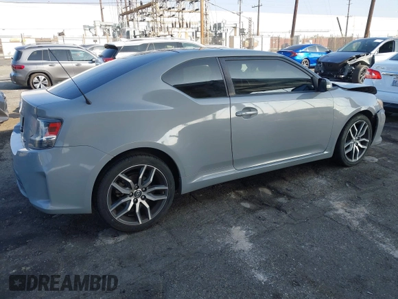 2014 Scion tC with VIN JTKJF5C7XE3079765, listed as a IAAI auction lot 41210220 with 114,410 mi miles. Bid and sale history available at carsss.com. Image 4.