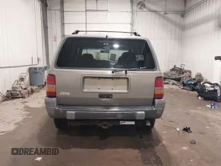 1996 Jeep Grand Cherokee Laredo with VIN 1J4GZ58S5TC182766, listed as a IAAI auction lot 41372356 with 234,390 mi miles. Bid and sale history available at carsss.com. Image 17.