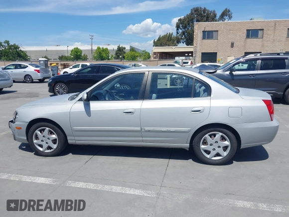 2004 Hyundai Elantra GLS z VIN KMHDN46D74U781436, wystawiony jako IAAI lot #42260519 z przebiegiem 132 943 mil mil oraz . Historia ofert i sprzedaży dostępna na DreamBid. Obrazek 14.