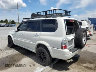 2004 Suzuki XL7 LX with VIN JS3TX92V444107106, listed as a Copart auction lot 62322035 with 94,380 mi miles and Salvage title. Bid and sale history available at DreamBid. Image 2.