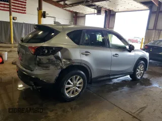 2014 Mazda CX-5 Touring z VIN JM3KE4CY5E0393463, wystawiony jako Copart lot #57776665 z przebiegiem 91 565 mil mil oraz Szkoda całkowita • Salvage title. Historia ofert i sprzedaży dostępna na DreamBid. Obrazek 3.
