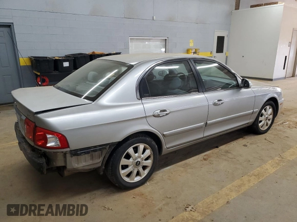 2005 Kia Optima LX z VIN KNAGD128155423463, wystawiony jako Copart lot #87441284 z przebiegiem 143 193 mil mil oraz Szkoda całkowita • Salvage title. Historia ofert i sprzedaży dostępna na DreamBid. Obrazek 3.