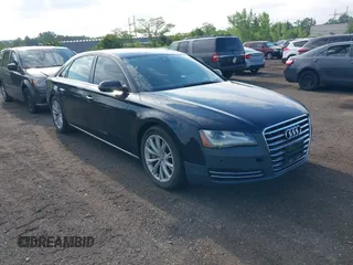 2011 Audi A8 with VIN WAURVAFD4BN018884, listed as a IAAI auction lot 42693000 with 116,952 mi miles and . Bid and sale history available at DreamBid. Image 1.