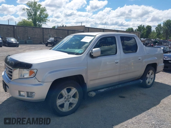 2013 Honda Ridgeline RTL with VIN 5FPYK1F51DB007236, listed as a IAAI auction lot 42762126 with 201,758 mi miles and . Bid and sale history available at DreamBid. Image 2.