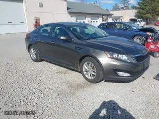 2012 Kia Optima LX with VIN 5XXGM4A72CG083861, listed as a IAAI auction lot 41909434 with 124,526 mi miles. Bid and sale history available at carsss.com. Image 1.