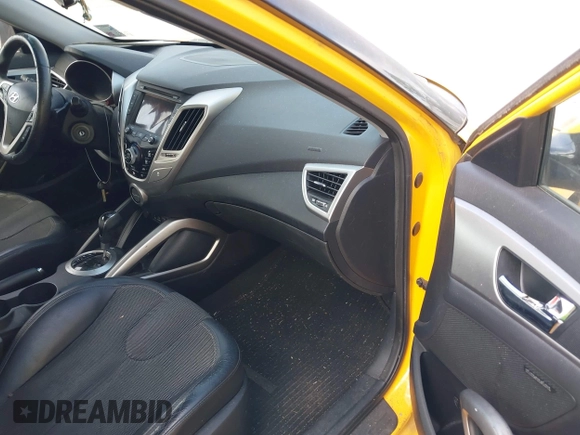 2012 Hyundai Veloster w/Gray Int z VIN KMHTC6AD7CU026855, wystawiony jako IAAI lot #42253694 z przebiegiem 119 802 mil mil oraz . Historia ofert i sprzedaży dostępna na DreamBid. Obrazek 5.