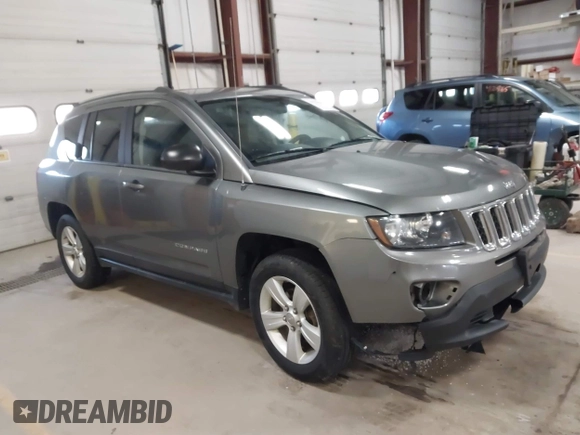 2014 Jeep Compass Sport with VIN 1C4NJDBB5ED567863, listed as a IAAI auction lot 41704644 with 163,405 mi miles. Bid and sale history available at carsss.com. Image 1.
