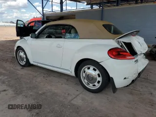 2013 Volkswagen Beetle 2.5L w/Sound/Nav z VIN 3VW5P7AT7DM811992, wystawiony jako Copart lot #59526355 z przebiegiem 102 542 mil mil oraz Szkoda całkowita • Salvage title. Historia ofert i sprzedaży dostępna na DreamBid. Obrazek 2.