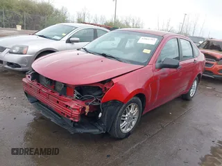 2009 Ford Focus SE with VIN 1FAHP35N09W136732, listed as a IAAI auction lot 42061783 with 143,993 mi miles. Bid and sale history available at carsss.com. Image 2.