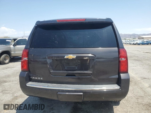 2015 Chevrolet Tahoe LTZ with VIN 1GNSKCKC2FR157035, listed as a Copart auction lot 59990415 with Not provided miles and Salvage title. Bid and sale history available at DreamBid. Image 6.