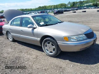 2001 Lincoln Continental z VIN 1LNHM97V31Y638576, wystawiony jako IAAI lot #42305531 z przebiegiem Nie podano mil oraz . Historia ofert i sprzedaży dostępna na DreamBid. Obrazek 1.