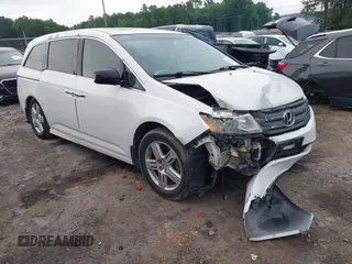 2012 Honda Odyssey Touring with VIN 5FNRL5H93CB034485, listed as a IAAI auction lot 42304502 with 198,589 mi miles and . Bid and sale history available at DreamBid. Image 1.