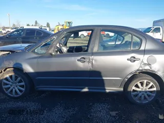 2010 Suzuki SX4 with VIN JS2YC5A40A6300053, listed as a IAAI auction lot 41392061 with 114,863 mi miles and . Bid and sale history available at DreamBid. Image 14.