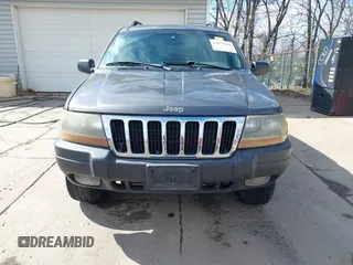 2003 Jeep Grand Cherokee Laredo with VIN 1J4GX48S53C504225, listed as a IAAI auction lot 41879669 with 247,246 mi miles. Bid and sale history available at carsss.com. Image 13.