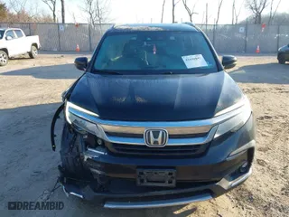 2019 Honda Pilot Touring 7-Passenger with VIN 5FNYF6H65KB061796, listed as a IAAI auction lot 41650857 with 122,417 mi miles. Bid and sale history available at carsss.com. Image 12.