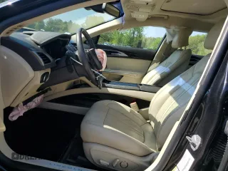2014 Lincoln MKZ z VIN 3LN6L2JK4ER805421, wystawiony jako Copart lot #56781605 z przebiegiem 90 061 mil mil oraz Tytuł czysty. Historia ofert i sprzedaży dostępna na DreamBid. Obrazek 7.