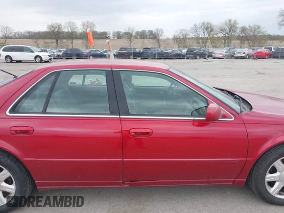 2001 Cadillac Seville z VIN 1G8KS54Y91U227846, wystawiony jako IAAI lot #42134095 z przebiegiem 216 766 mil mil oraz . Historia ofert i sprzedaży dostępna na DreamBid. Obrazek 13.
